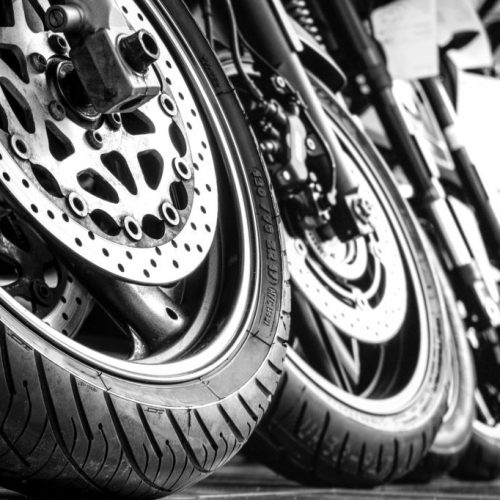 Motorcycles front wheels in a row
